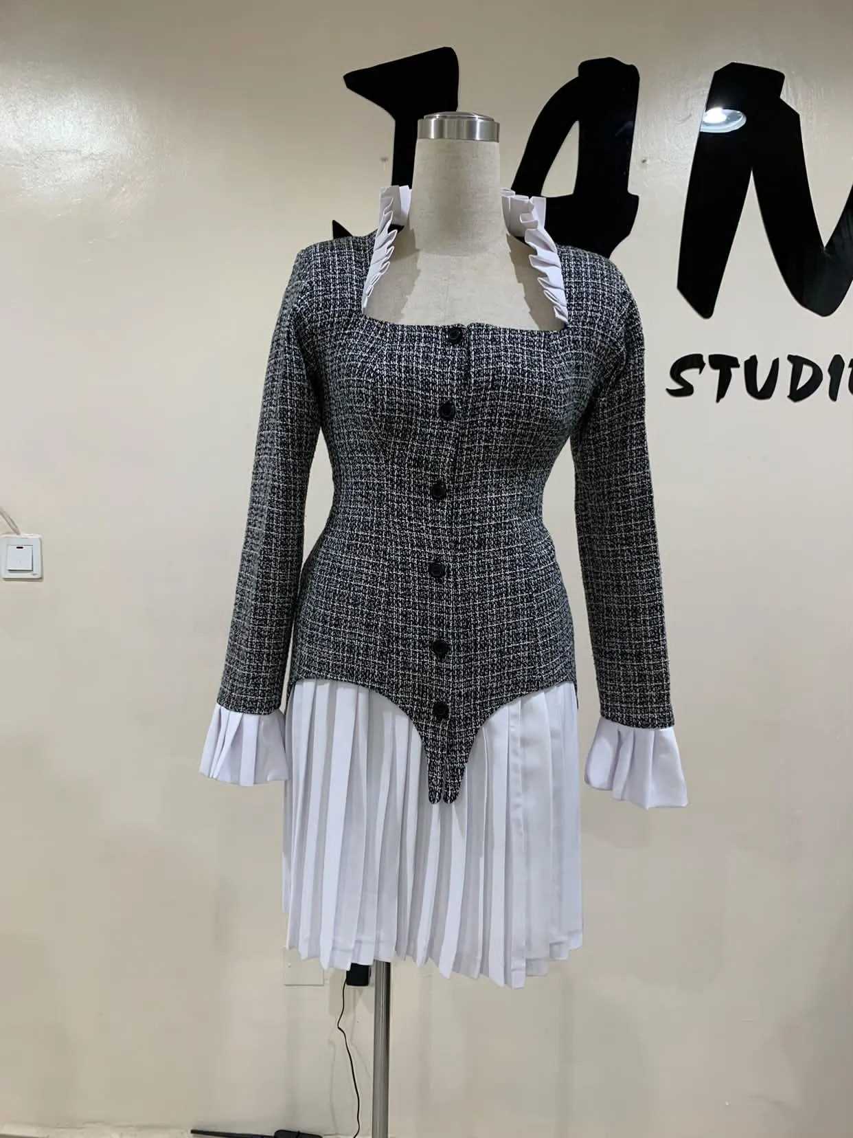 A black and white corporate blazer and skirt.